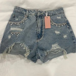 Denim shorts with pearls and rhinestones